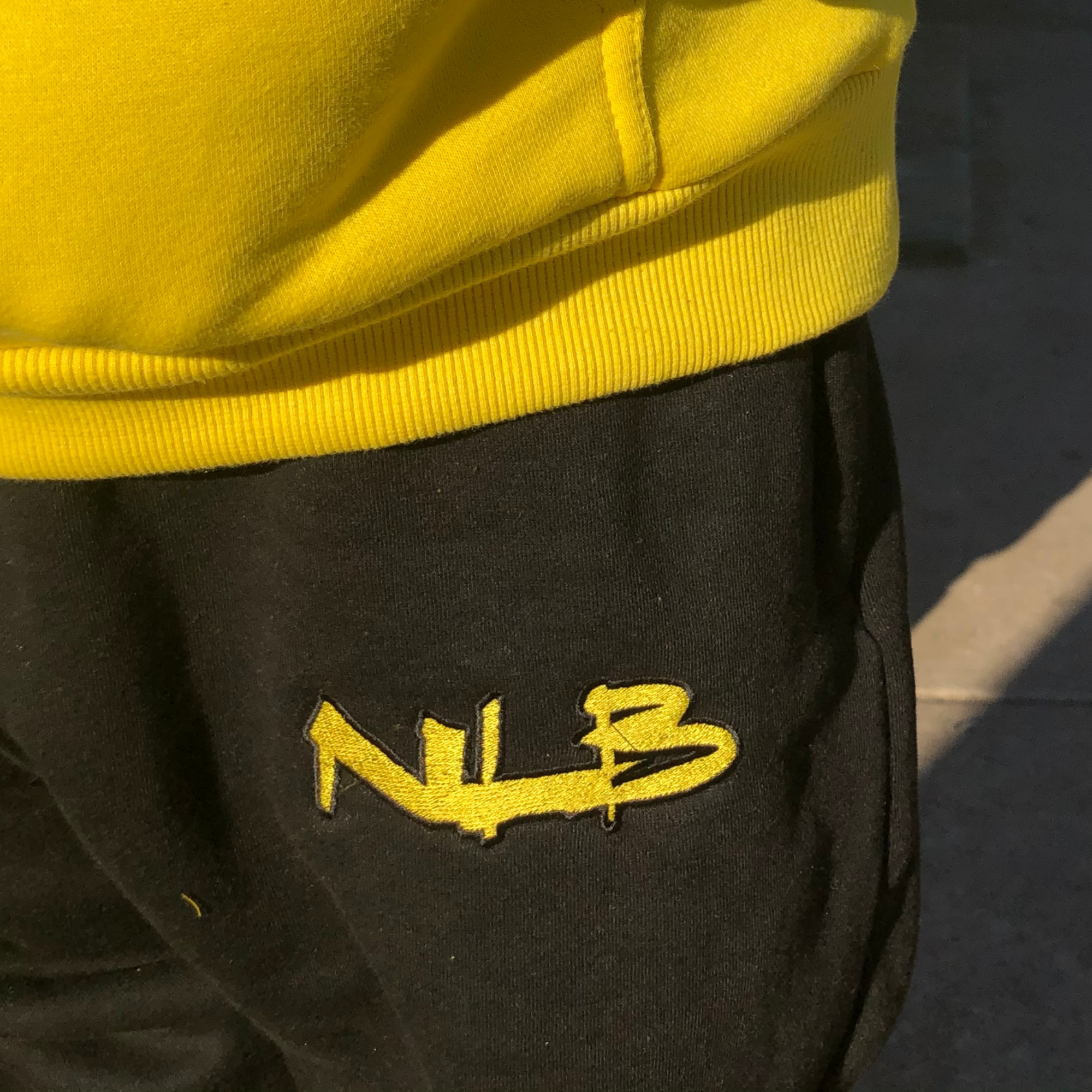 Yellow and 2025 black sweatpants